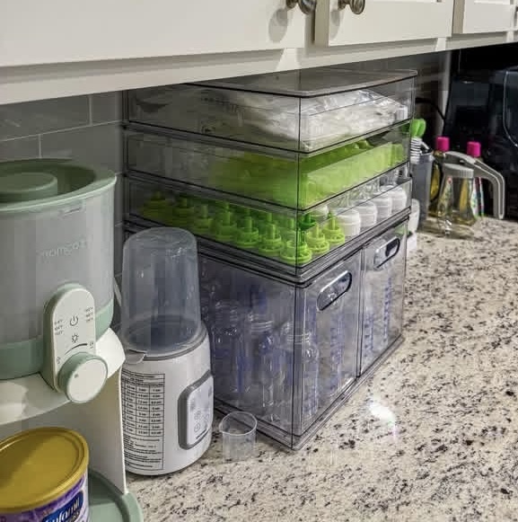 Organized baby bottle station with sterilized bottles and feeding supplies