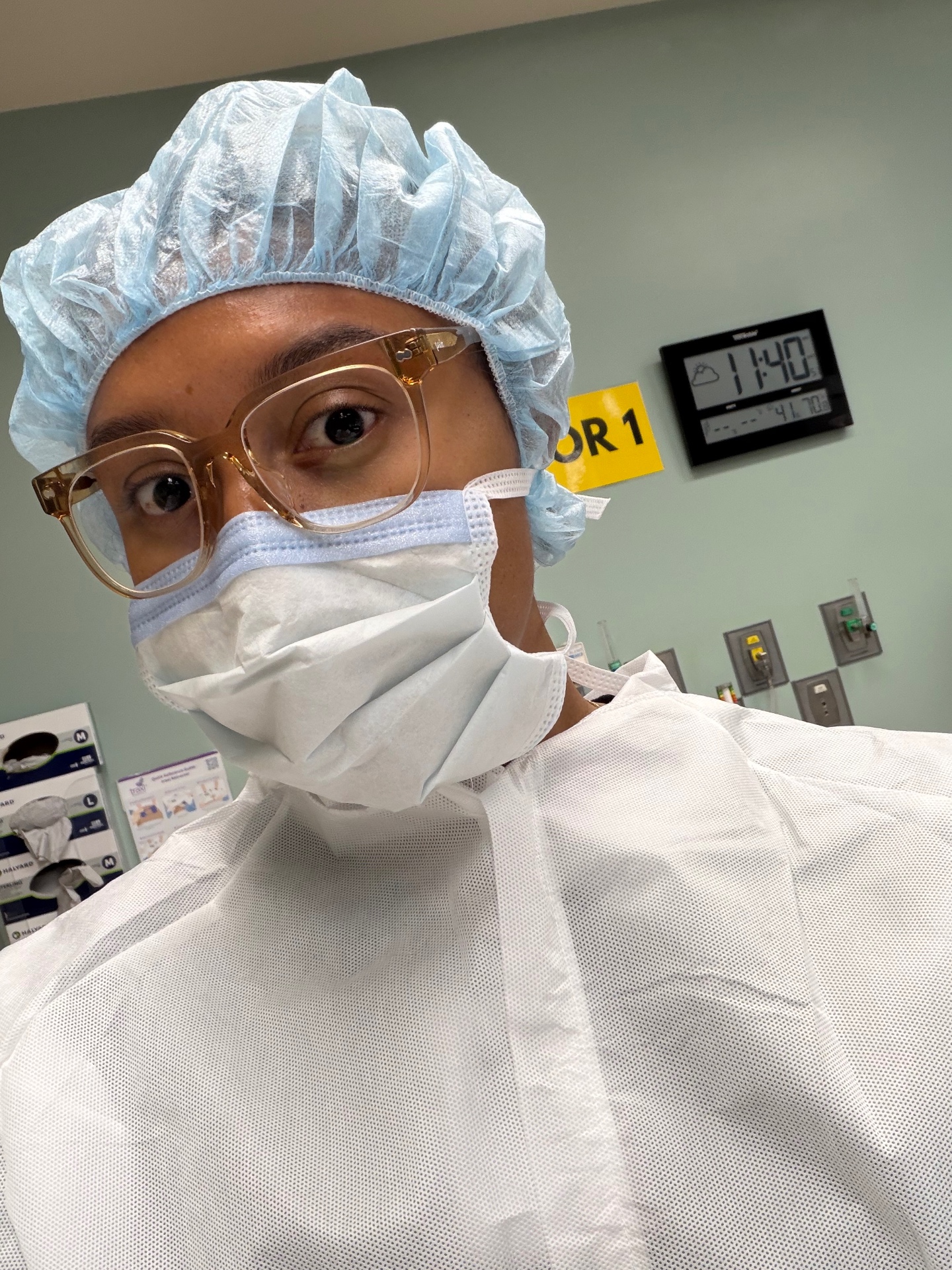 Certified birth doula in surgical attire inside the operating room